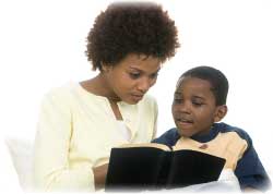 mother reading book with son